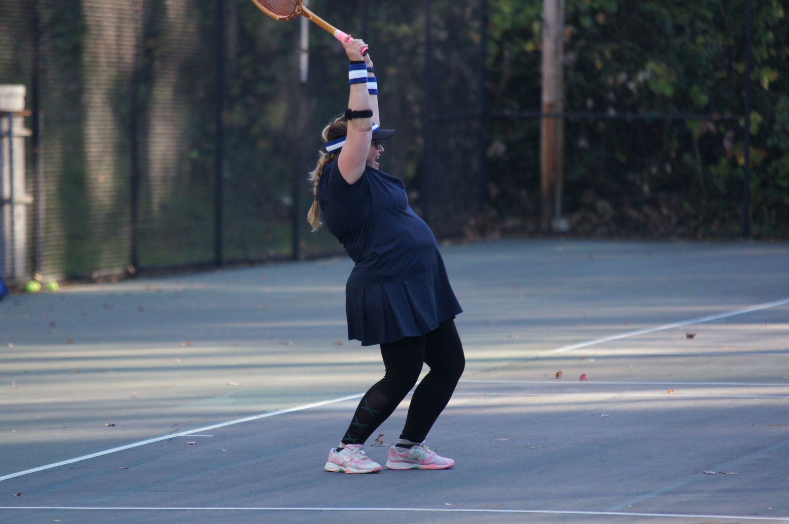 A player celebrating a point with a wooden racquet at the 2024 Durham Retro Racquet Classic