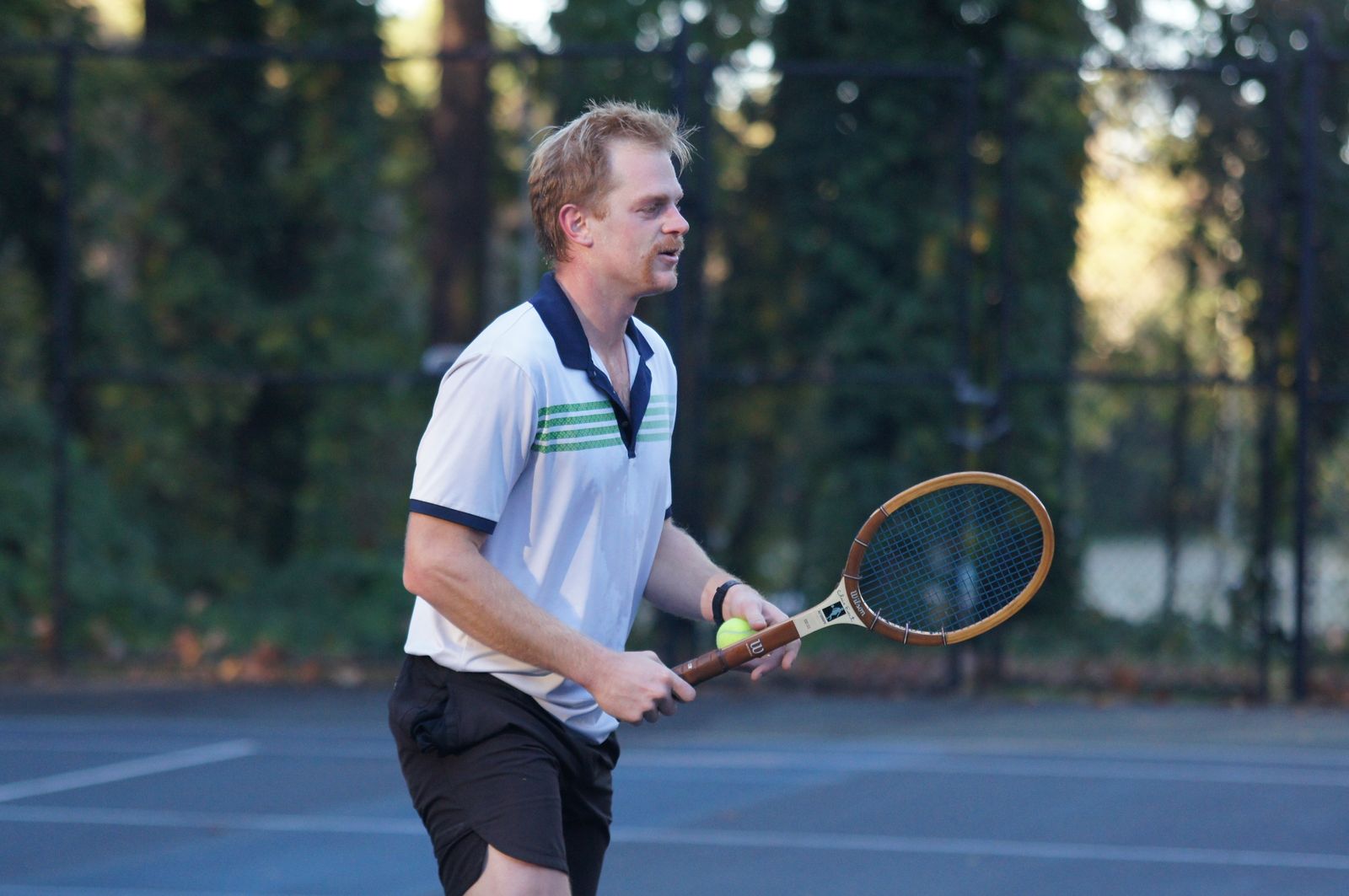 A player with a vintage wooden Wilson racquet at the Durham Retro Racquet Classic